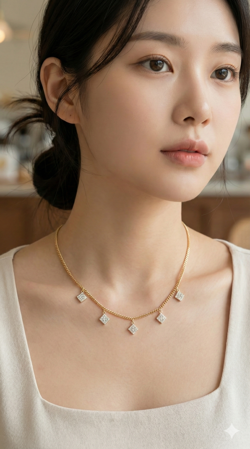 Woman wearing a gold necklace with diamond pendants against a blurred background
